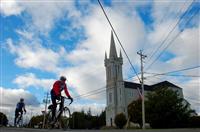 Cycling by Eglise Sainte-Marie  (Carla Allen)